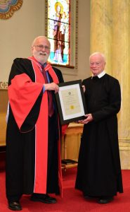 Fr. Jonathan Robinson is given the Culture of Life Award by Dr. Keith Cassidy