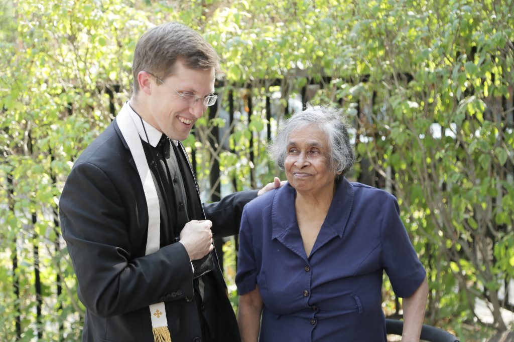 Fr. Michael speaks with a resident.