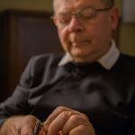 An Oratorian crafts a rosary.