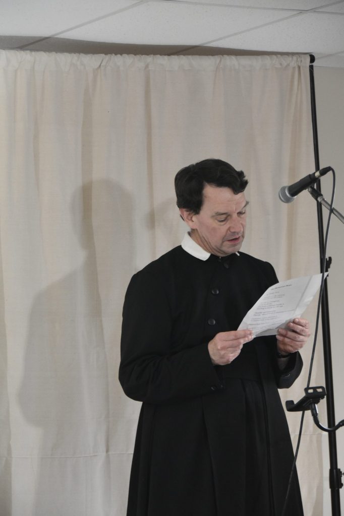 Fr Derek reads a poem by Sherwin Saverimuttu