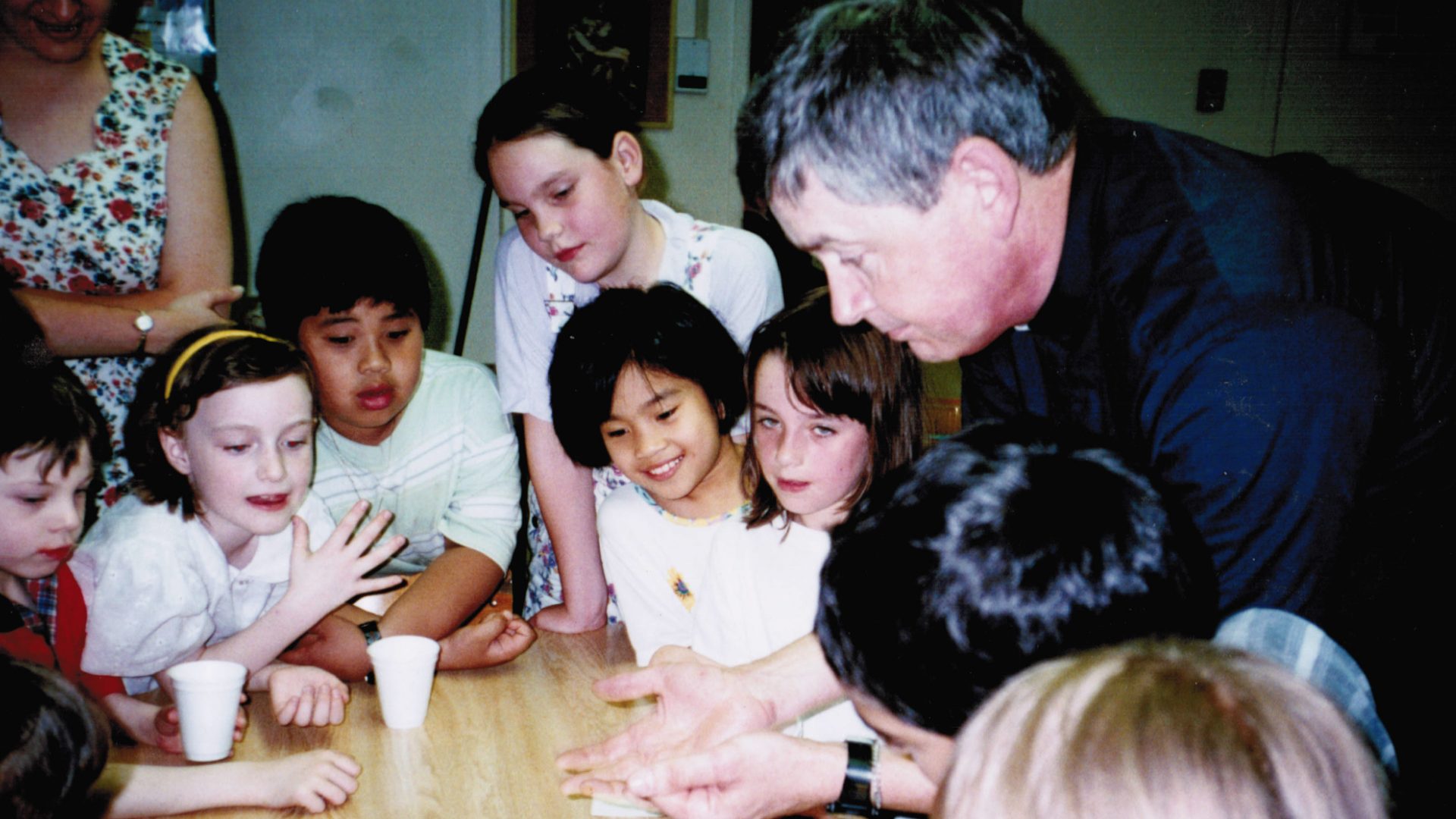 Fr David dazzles the children with his magic tricks
