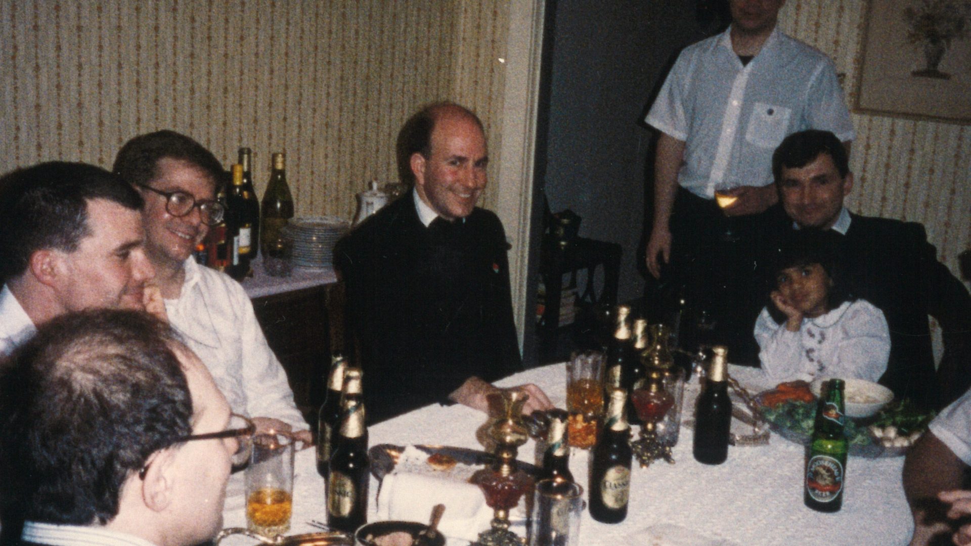 Oratorians having dinner at the home of parishioners