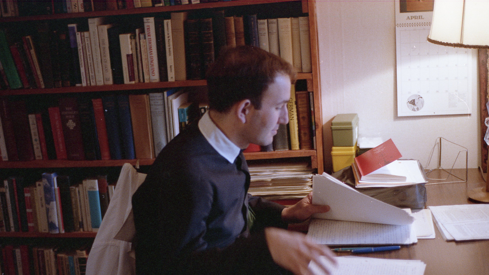 Fr Juvenal reads in his study