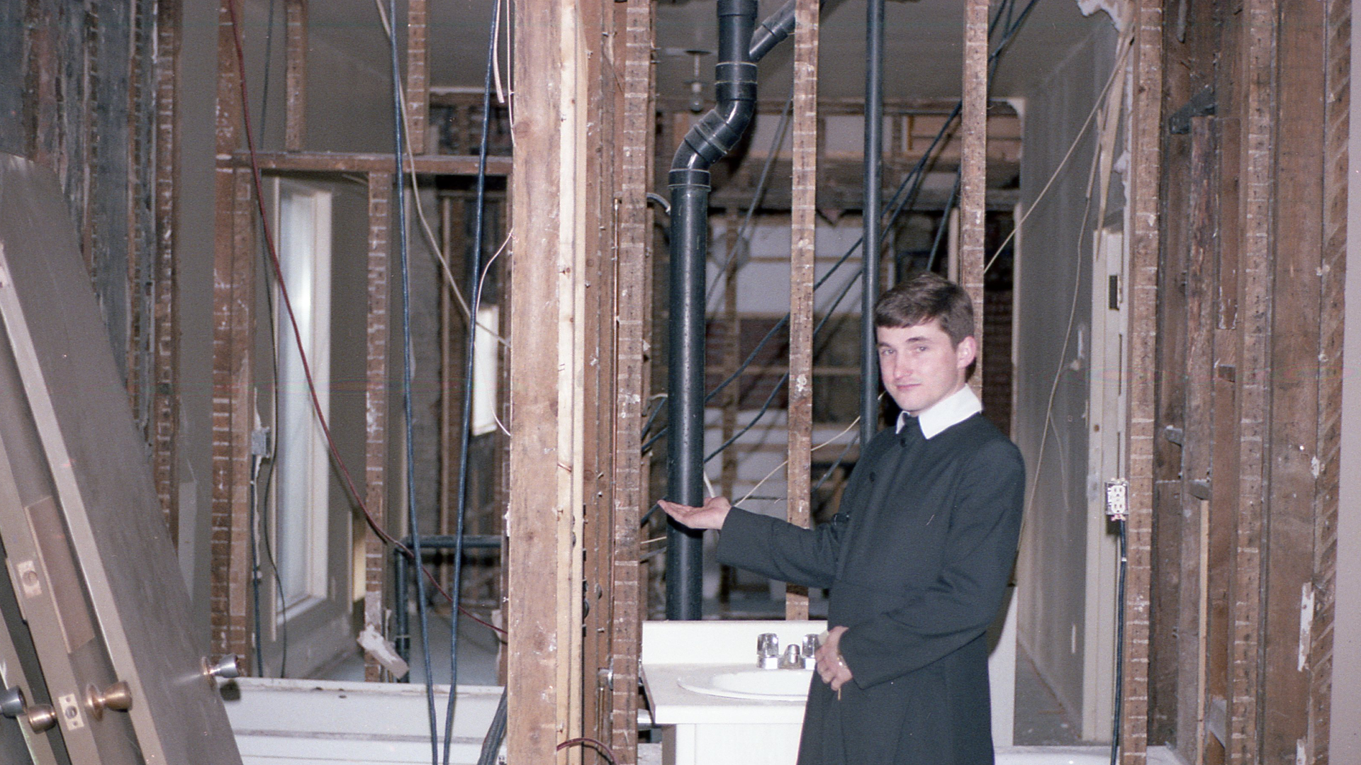 Fr Tom shows off the construction at Holy Family