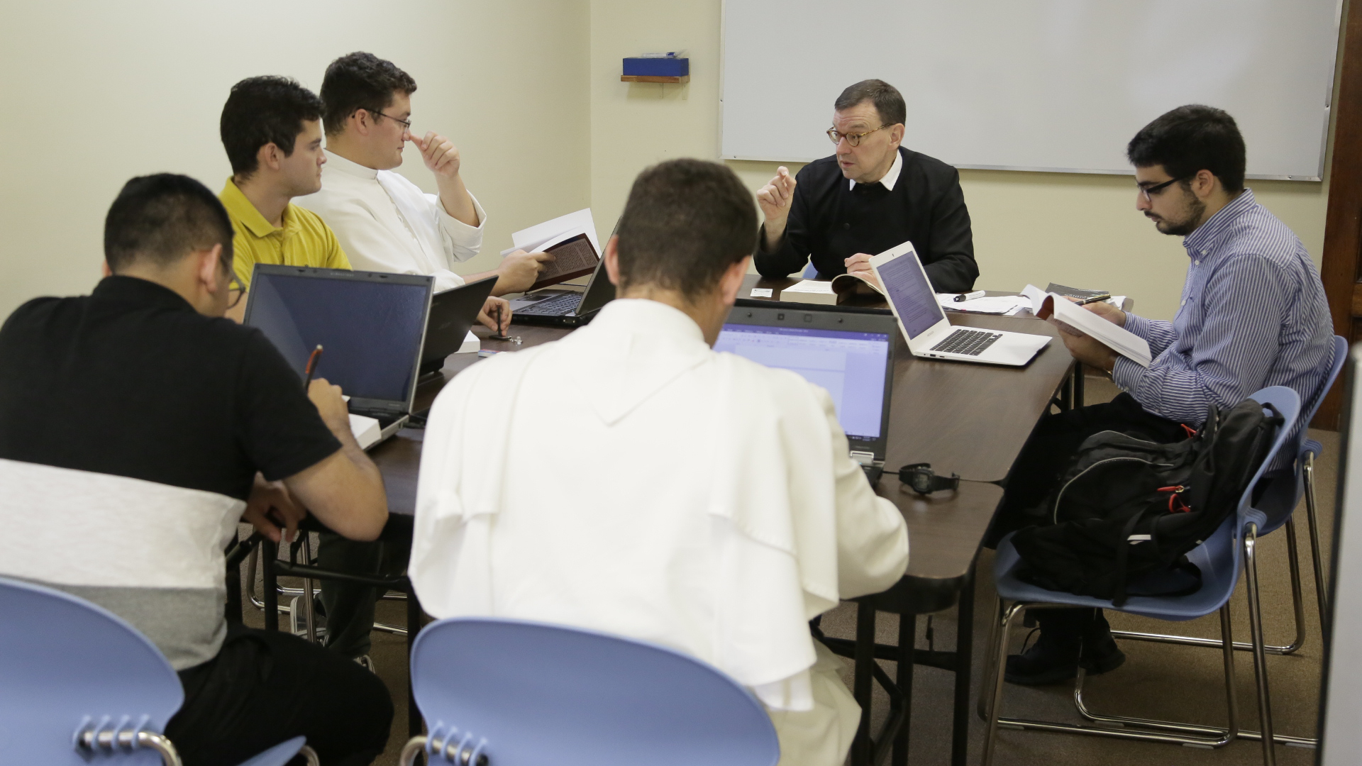 Fr Derek teaches a class