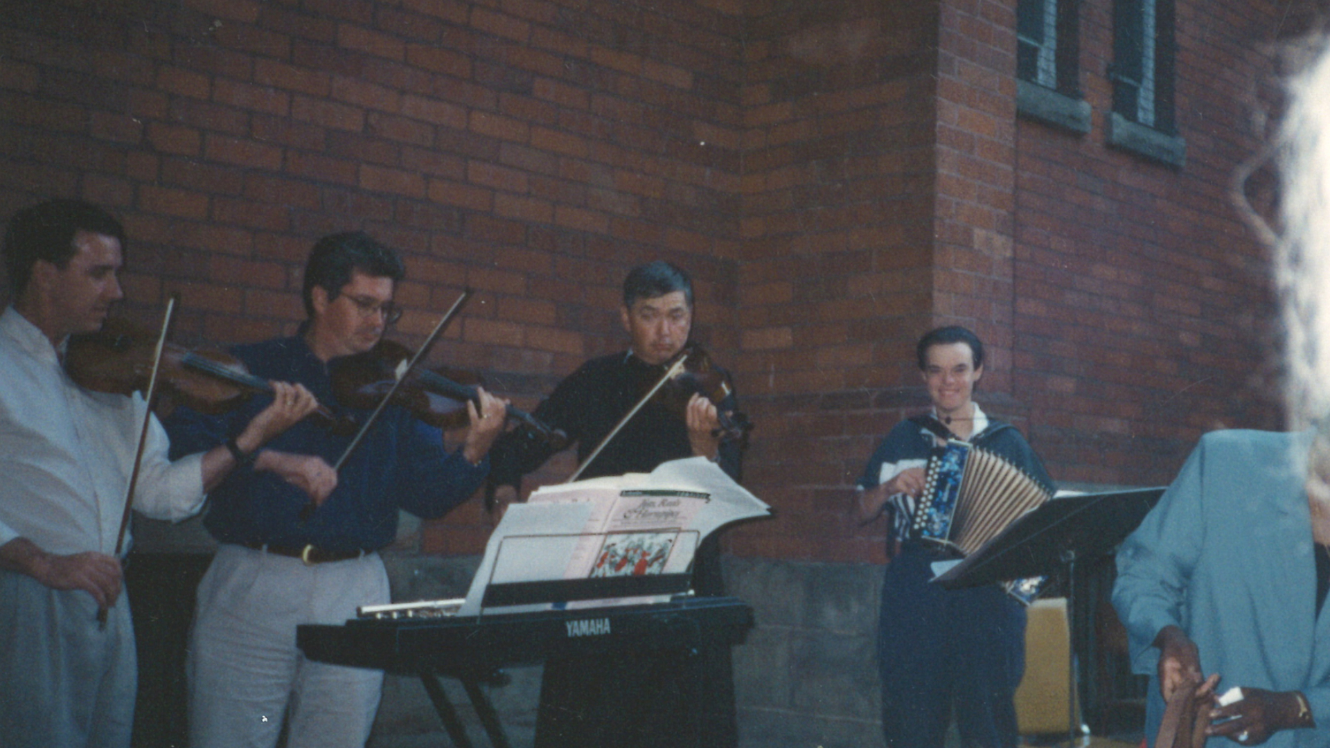 Fr David performs with parishioners