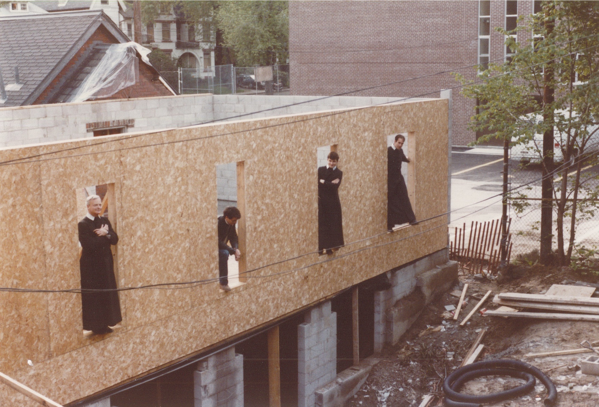 Fr Robinson, Peter Bishop, Fr Tom, and Fr Juvenal inspect the new chapel construction