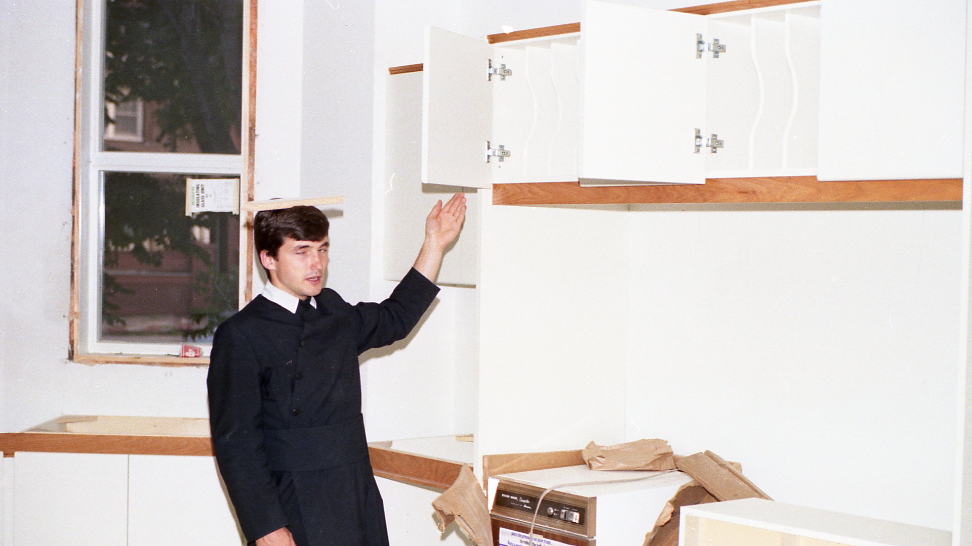 Fr Tom shows off the construction at Holy Family